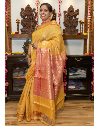 Red & Yellow Tussar Saree with subtle Zari Buttis