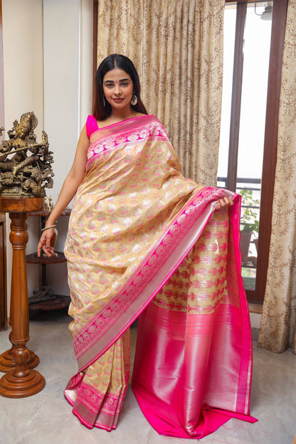 Model in beige and pink Banarasi Katan silk saree with silver zari motifs and meenakari detailing – front styling view.