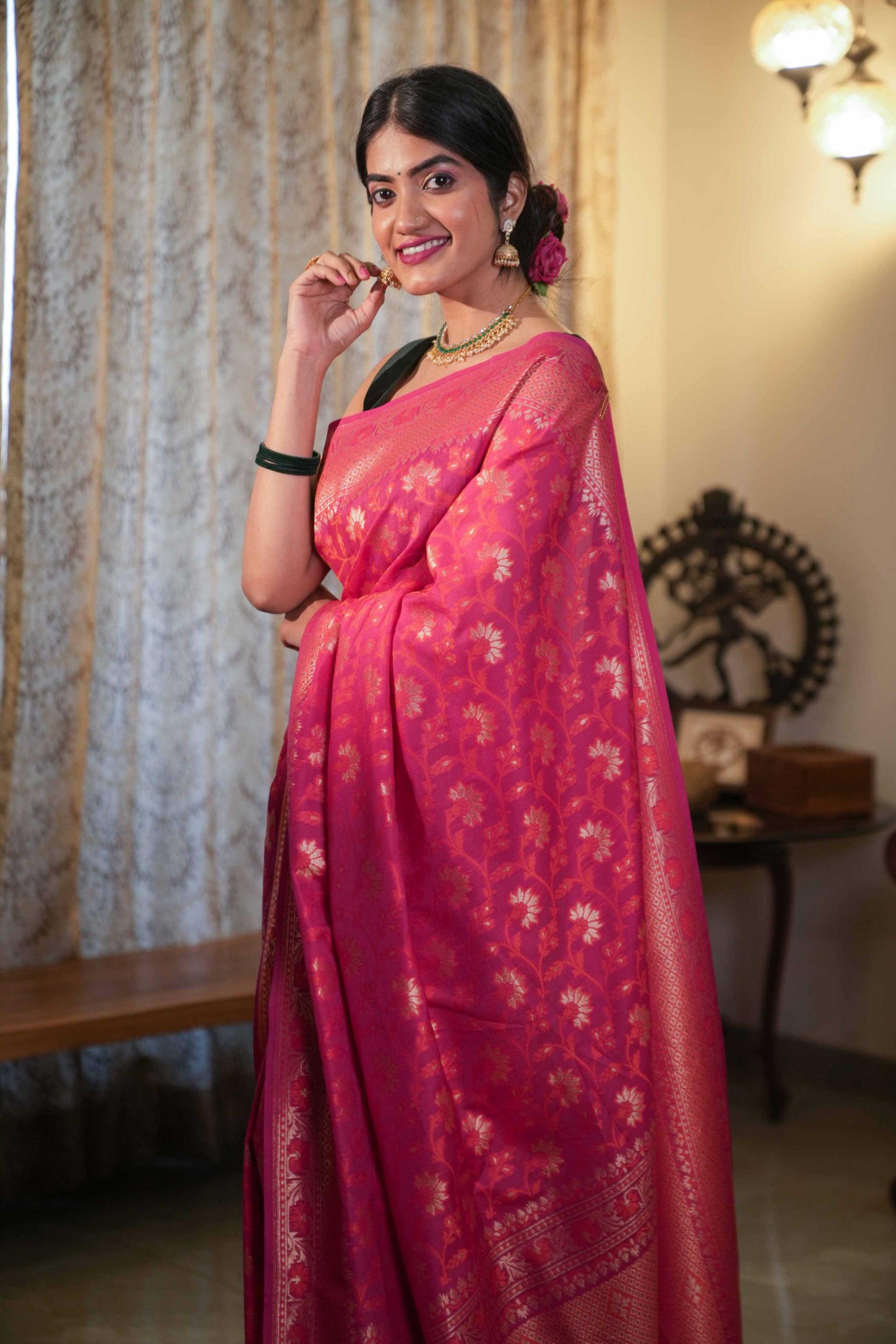 Front look of Pink Katan Georgette Banarasi saree with zari border and all-over jaal work – traditional Indian handloom wear.